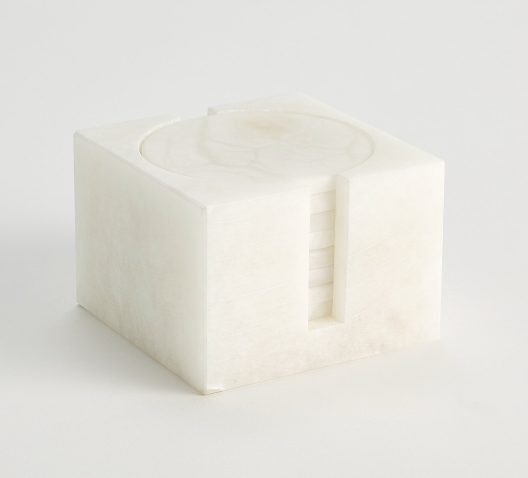 alabaster coasters inside the holder